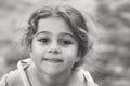 Black and white Portrait of smiling cute little girl at summer park. Happy child looking at the camera Royalty Free Stock Photo