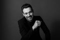 Black and white portrait of a smiling young handsome man in a suit Royalty Free Stock Photo