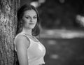 Black and white portrait of stunning young woman in park Royalty Free Stock Photo