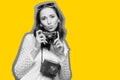 Black white portrait of a traveler girl shoots to the camera with a yellow stroke