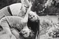 Black and white Portrait of Two Cute little girls embracing and laughing at garden. Happy kids outdoors Royalty Free Stock Photo