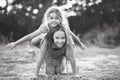 Black and white portrait of Two Cute little girls playing and laughing at the countryside. Happy kids outdoors concept Royalty Free Stock Photo