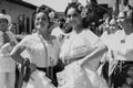 Black and white portrait of two smiling latin women dressed with traditional clothes from Veracruz