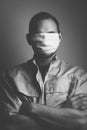 Black and white portrait of a young man in a medical mask, the concept of psychological pressure due to the coronavirus, a man