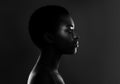 Black And White Profile Shot Of Beautiful African Female Over Dark Background