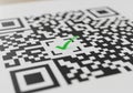 Black and white QR code on a white background, featuring a green check mark overlay near the Royalty Free Stock Photo