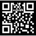 Black and white QR code pattern on a solid black background for digital scanning and information retrieval Royalty Free Stock Photo