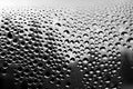 black and white raindrops on the window