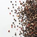 Black, white and red peppercorns on a white background.