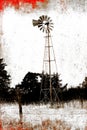 Black and White with red photo of old Windmill in field Royalty Free Stock Photo