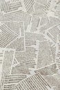 Black and white repeating torn newspaper background. Continuous pattern left, right, up and down Royalty Free Stock Photo