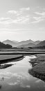 Black And White River Photograph With Rice Fields: Capturing The Beauty Of Japan\'s Coastal Landscapes