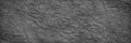 Black white rock texture. It looks like a rough concrete wall surface. Dark gray stone grunge background with space for design. Royalty Free Stock Photo