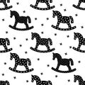 Black and white rocking horses seamless christmas pattern. Royalty Free Stock Photo