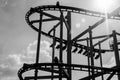 Black and white rollercoaster track in amusement park. Royalty Free Stock Photo