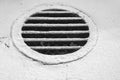 Monochrome round air conditioning outlet with grille Royalty Free Stock Photo