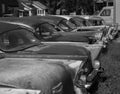 Black and White Row of Classic Salvaged 57 Chevys