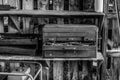 black & white rusty old toolboxes in shed