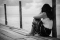 Black and white of Sad and lonely woman sitting alone Royalty Free Stock Photo