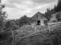 Black and white scenery of the Carpathian mountain village private farm on September day
