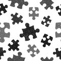 Black and white seamless pattern with doodle puzzle pieces. Royalty Free Stock Photo