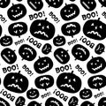 Black and white seamless pattern with pumpkin silhouette and inscription Boo.