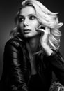 Black and white sensual portrait of a beautiful young woman. Blonde in leather jacket Royalty Free Stock Photo