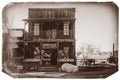 Black and White Sepia Vintage Photo of Old Western Wooden Building in Goldfield Gold Mine Ghost Town in Youngsberg Royalty Free Stock Photo