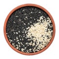 Black and white sesame seeds in a bowl isolated on white background. Top view Royalty Free Stock Photo