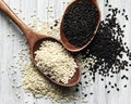 Black and white sesame seeds in a spoons Royalty Free Stock Photo