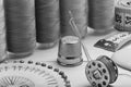 Black and white sewing kit. threads on bobbins, centimeter tape and thimble Royalty Free Stock Photo