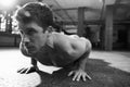 Black And White Shot Of Bare Chested Man Doing Press-Ups Royalty Free Stock Photo