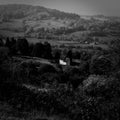 Black and white shot of a cottage in countryside Royalty Free Stock Photo