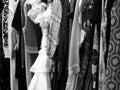 Black and white shot of different clothes and dresses hanging in the closet Royalty Free Stock Photo