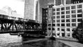 Black & White shot of elevated `el` train passing over the Lake Street bridge, crossing the Chicago River in the Loop. Royalty Free Stock Photo