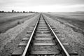 black and white shot of empty rural rail track