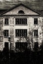 Black and white shot of haunted villa and cloudy sky Royalty Free Stock Photo