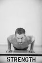 Black And White Shot Of Man In Gym Doing Press-Ups Royalty Free Stock Photo