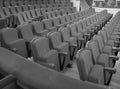 Black-and-white shot, monochrome, traditional, classic rows of empty chairs, the interior of a cinema or concert hall Royalty Free Stock Photo