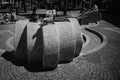 Black and white shot of pigeons on a stone rock in downtown Frankfurt, Germany