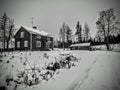 Black and white shot of simple farm houses in northern Sweden