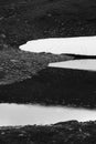 Black and white shot of thawing glacier in rain