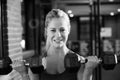 Black And White Shot Of Woman In Gym Lifting Hand Weights Royalty Free Stock Photo