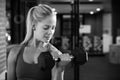 Black And White Shot Of Woman In Gym Lifting Hand Weights Royalty Free Stock Photo