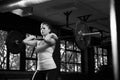 Black And White Shot Of Woman In Gym Lifting Weights Royalty Free Stock Photo