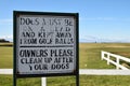 Authentic sign on golf course about dogs