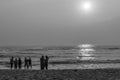 Black and white silhouette of group of friends and family having peaceful and leisure time