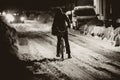 Woman riding bicycle in snow Royalty Free Stock Photo