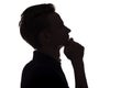 Silhouette portrait of thoughtful guy, man face profile on a white isolated background Royalty Free Stock Photo