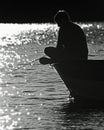 Serenity : Boy Fishing on Lake, BW Royalty Free Stock Photo